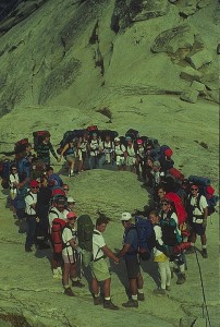 A group of people standing around in the middle of a circle.