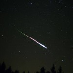 A meteor is seen in the sky at night.