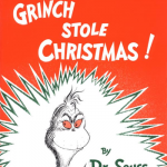 A book cover with the grinch and his name written in red.