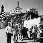 A group of people standing on top of a beach.